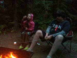 Grace and Ben Roast Marshmellows over a campfire at the Shuswap